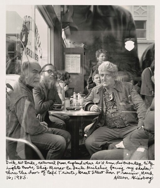 A photograph of Dick McBride, Shig Murao and Jack Micheline at Caffe Trieste, 1985 by Allen Ginsberg.
